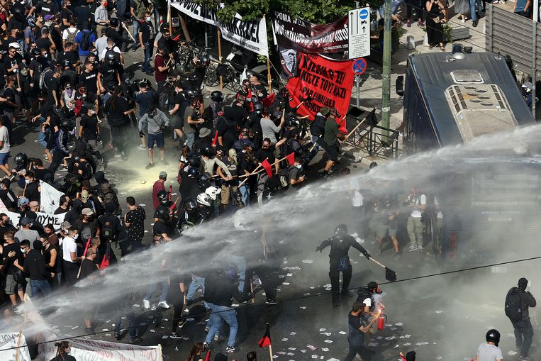 Anti-Golden Days Council protesters demonstrate at the court building in Athens.  The riot police had to deploy the water cannon.